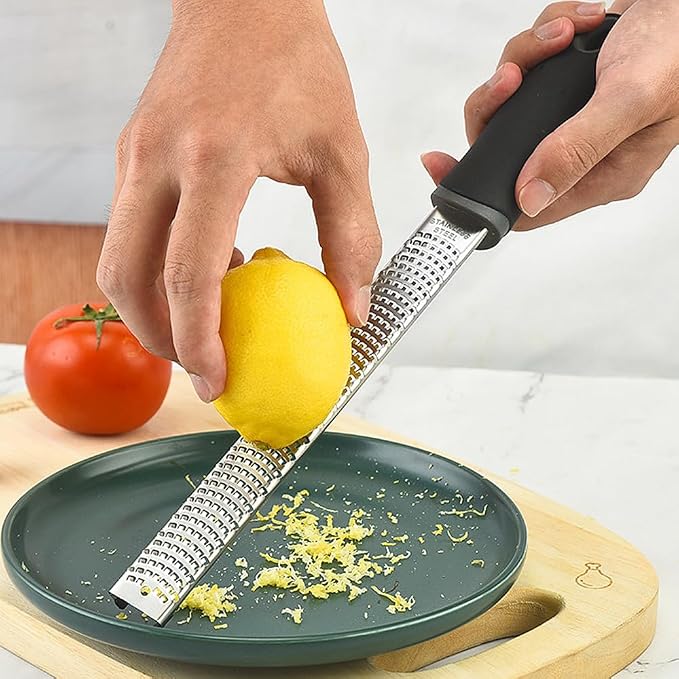 1Pack Lemon Zester Stainless Steel Cheese Grater with Plastic Cover Ergonomic Soft Black Handle Handheld Rotary Cheese Grater Zester Ideal for Kitchen Use and Food Preparation