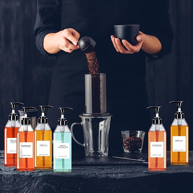 Nuogo 6 Pcs Coffee Syrup Dispenser Bottles Set 750ml, 500ml, 300ml, 150ml PET Black Syrup Bottles with Pump Dispenser 27 Labels for Coffee Bar Kitchen Accessories Portable Travel(16.9 oz,Square)