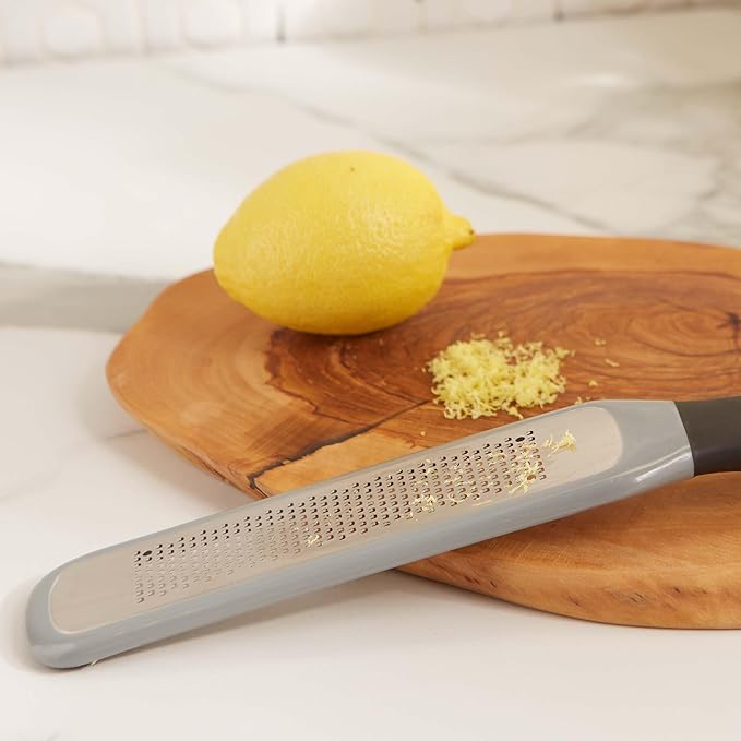 RSVP International Paddle Grater, Etched Steel Blades, Stainless Steel Hand Held Kitchen Cheese & Vegetable Shredder Comfort Grip Handle and Anti-Slip Foot and Safety Cover, Fine Zester