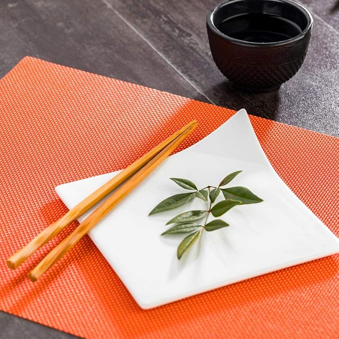 Restaurantware Carmel Mesh 16 x 12 Inch Table Placemats Set Of 6 Woven Washable Placemats - Heat Tolerant No Stain Tangerine Vinyl Kitchen Placemats Waterproof Easy To Clean